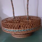 Glass holder and wicker bottle with green plastic water surface