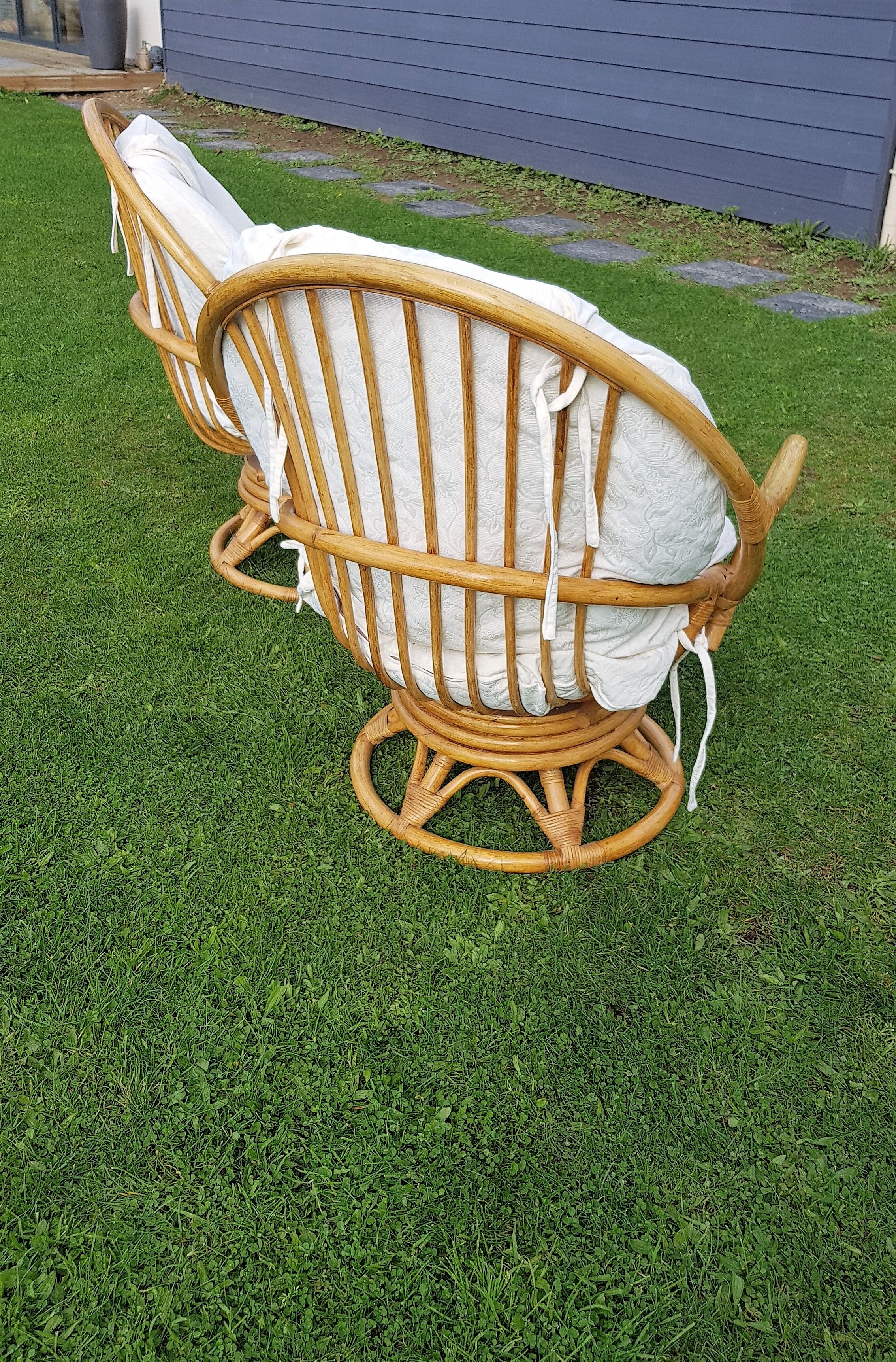 Pair of swivel rattan armchairs