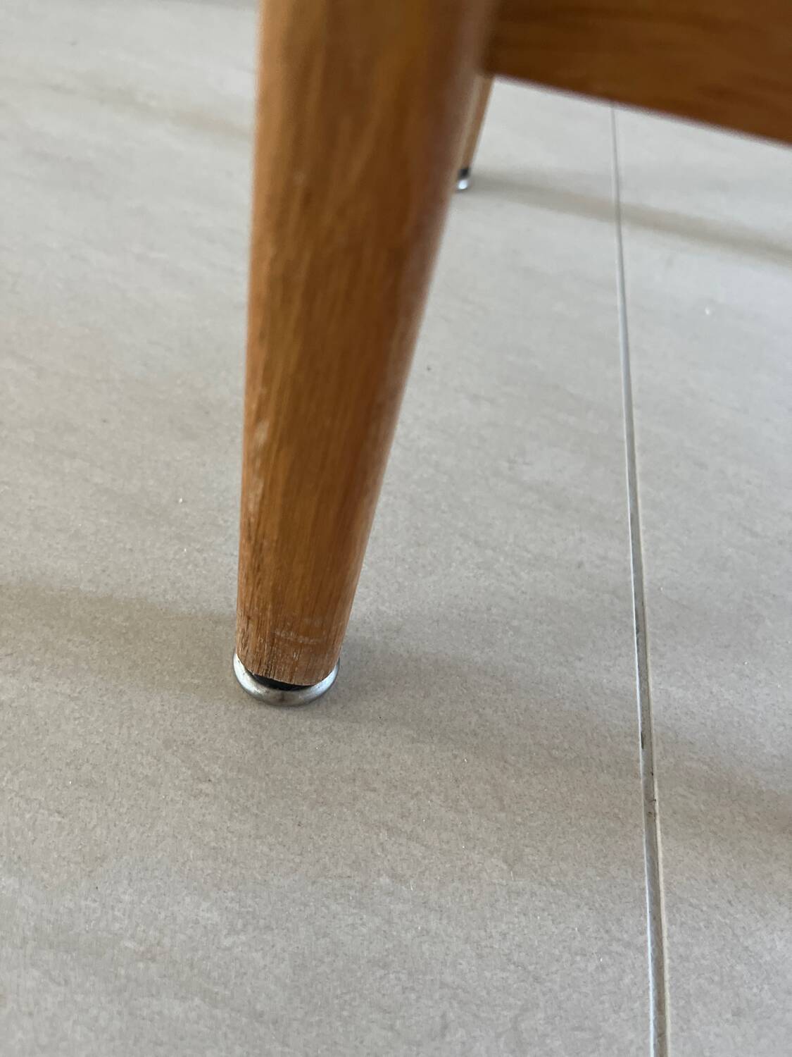 Vintage stool from the 60s with aged leather seat