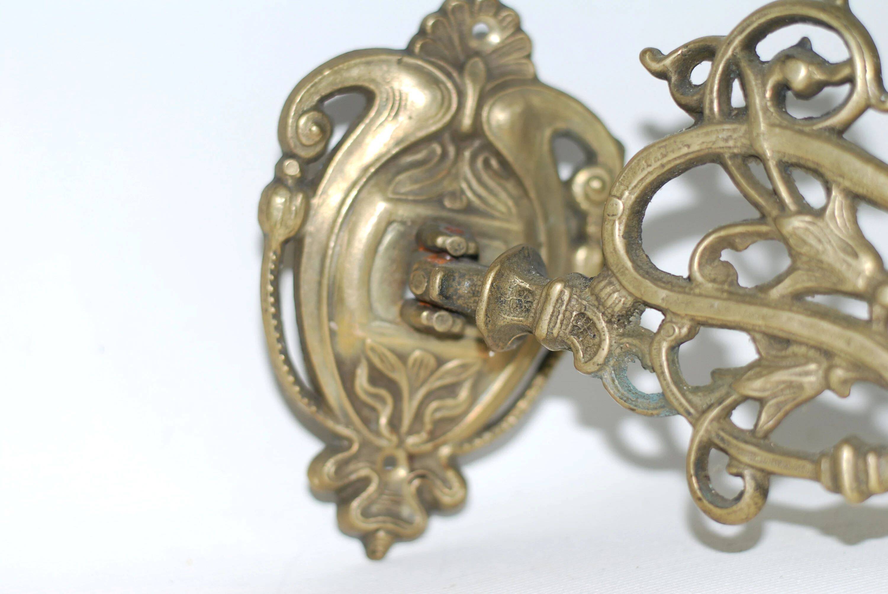 Pair of wall candle holders in brass