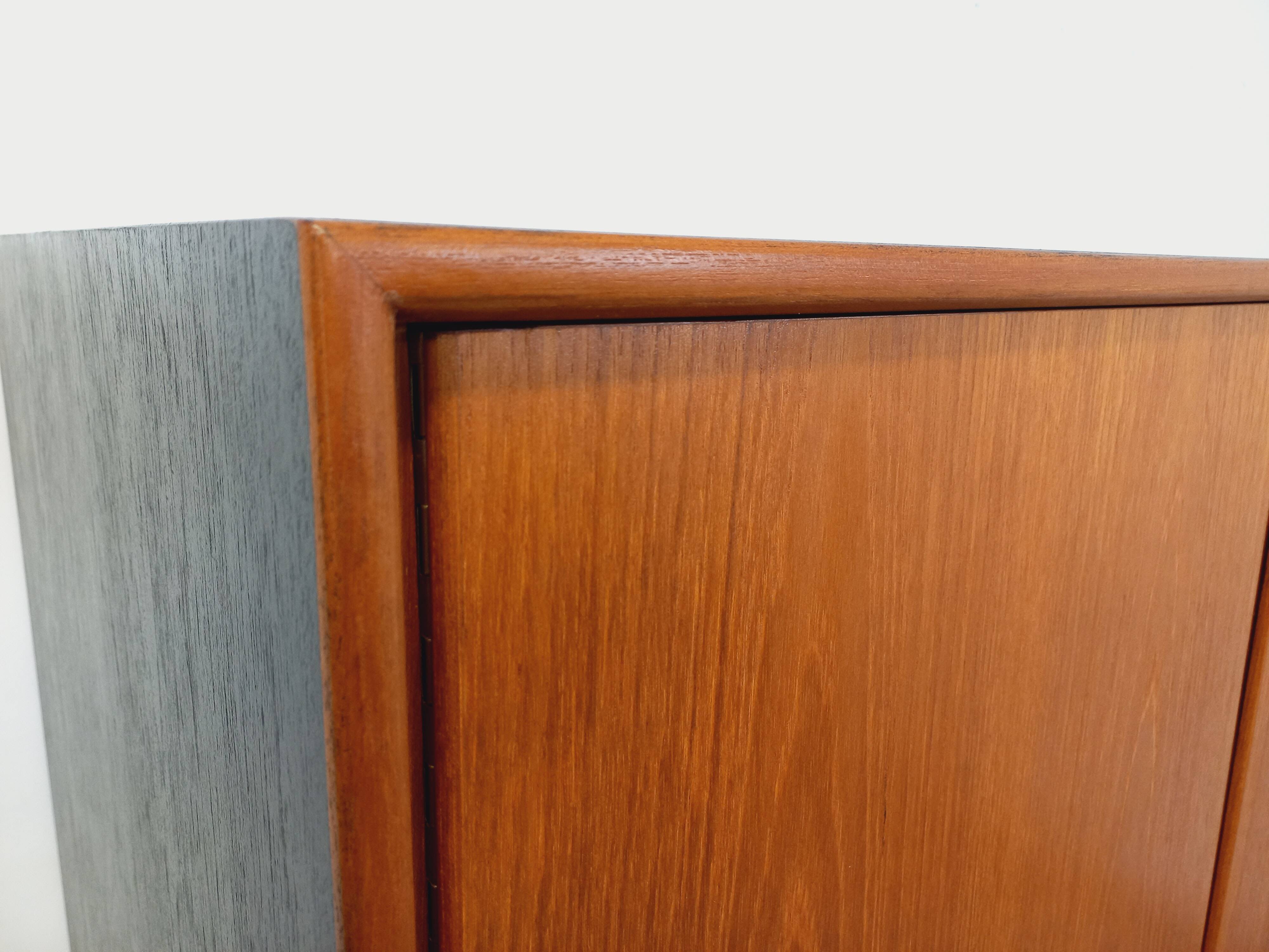 Vintage Scandinavian modernist wardrobe in teak and metal from the 1960s.