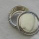 Small round silver metal box SNPA.