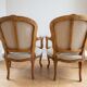 Pair of Louis XV/XVI armchairs in carved wood and floral fabric.