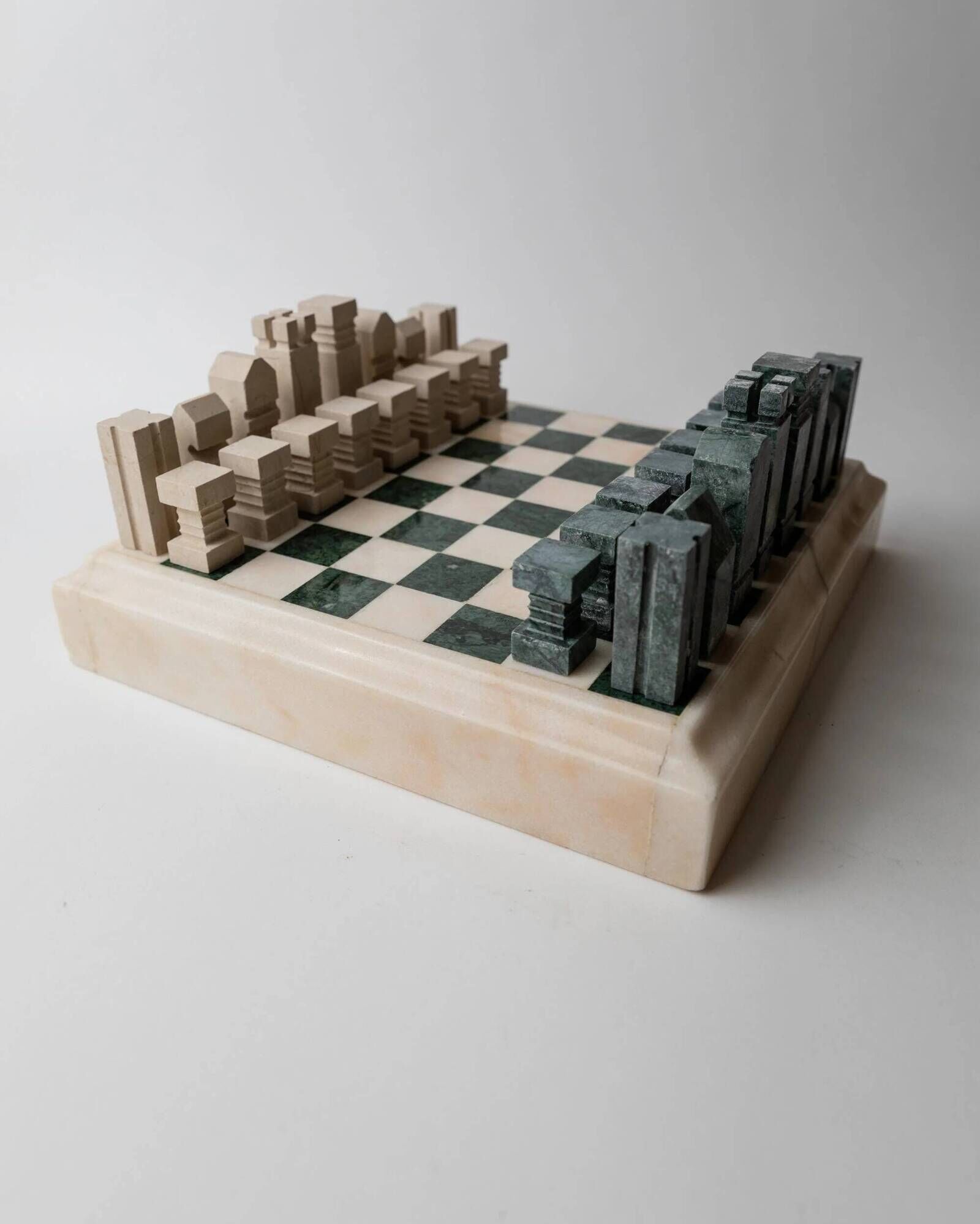 Vintage marble chess set from the 1970s, green and beige stone board, heavy design, geometric pieces, sculptural tabletop game, gift idea.