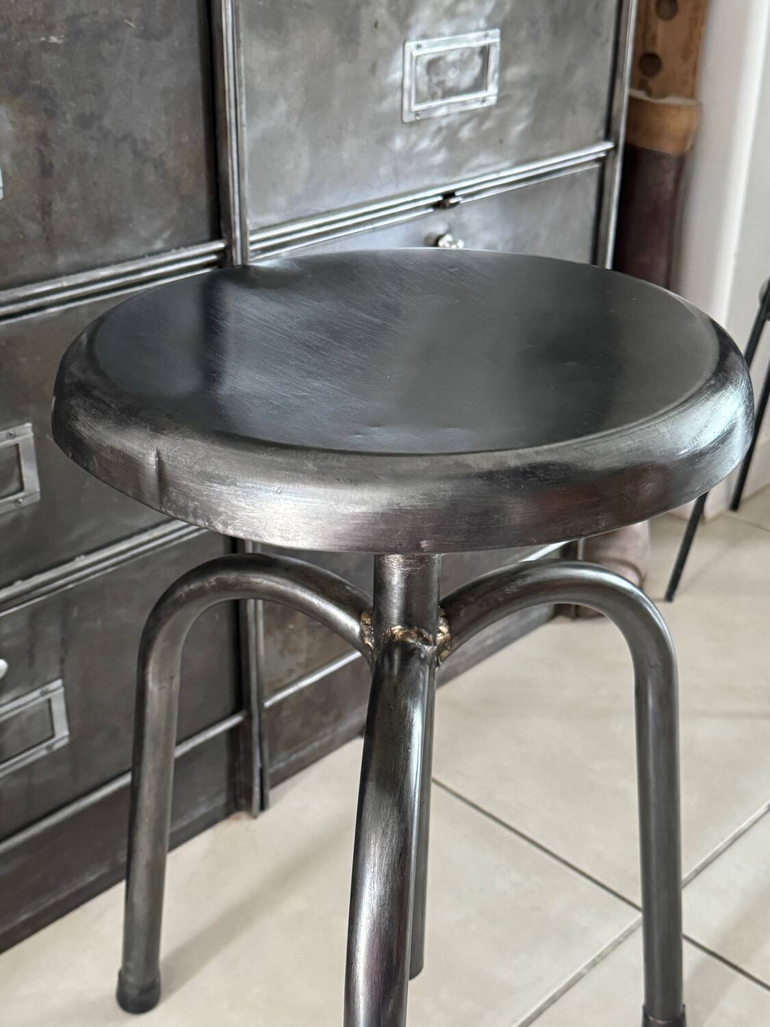 Height-adjustable tripod metal stool