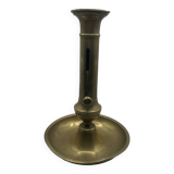 Candle holder with a pusher