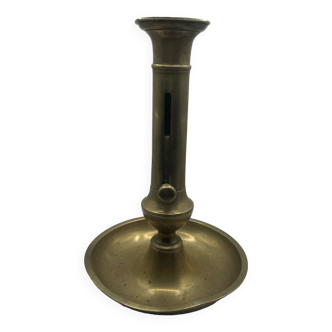 Candle holder with a pusher