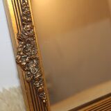 Small rectangular mirror in gilded wood with a pediment decorated with flowers