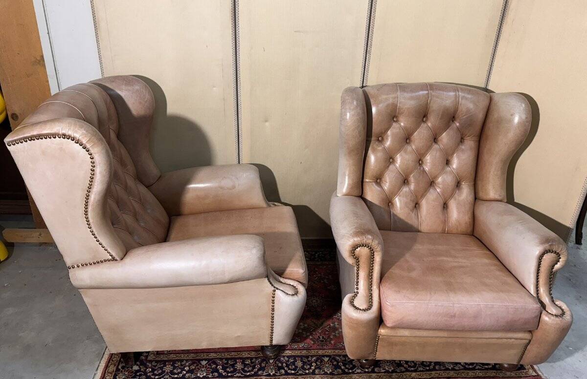 Pair of Chesterfield leather wingback armchairs