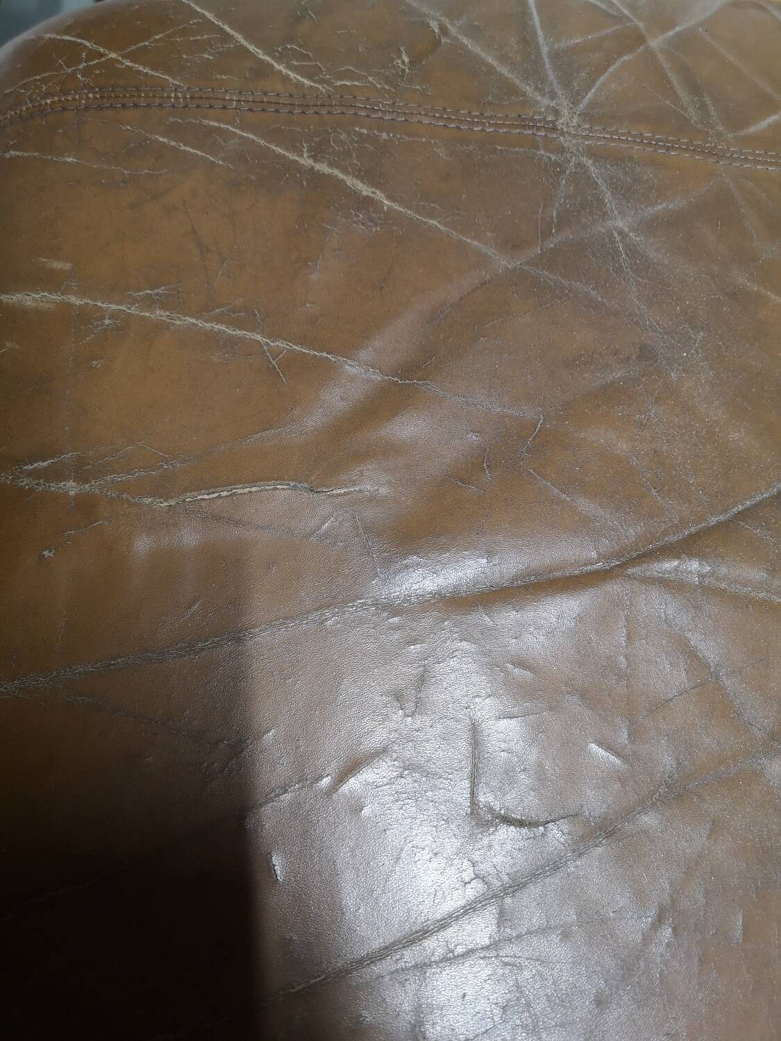 70s lounge chair in camel leather