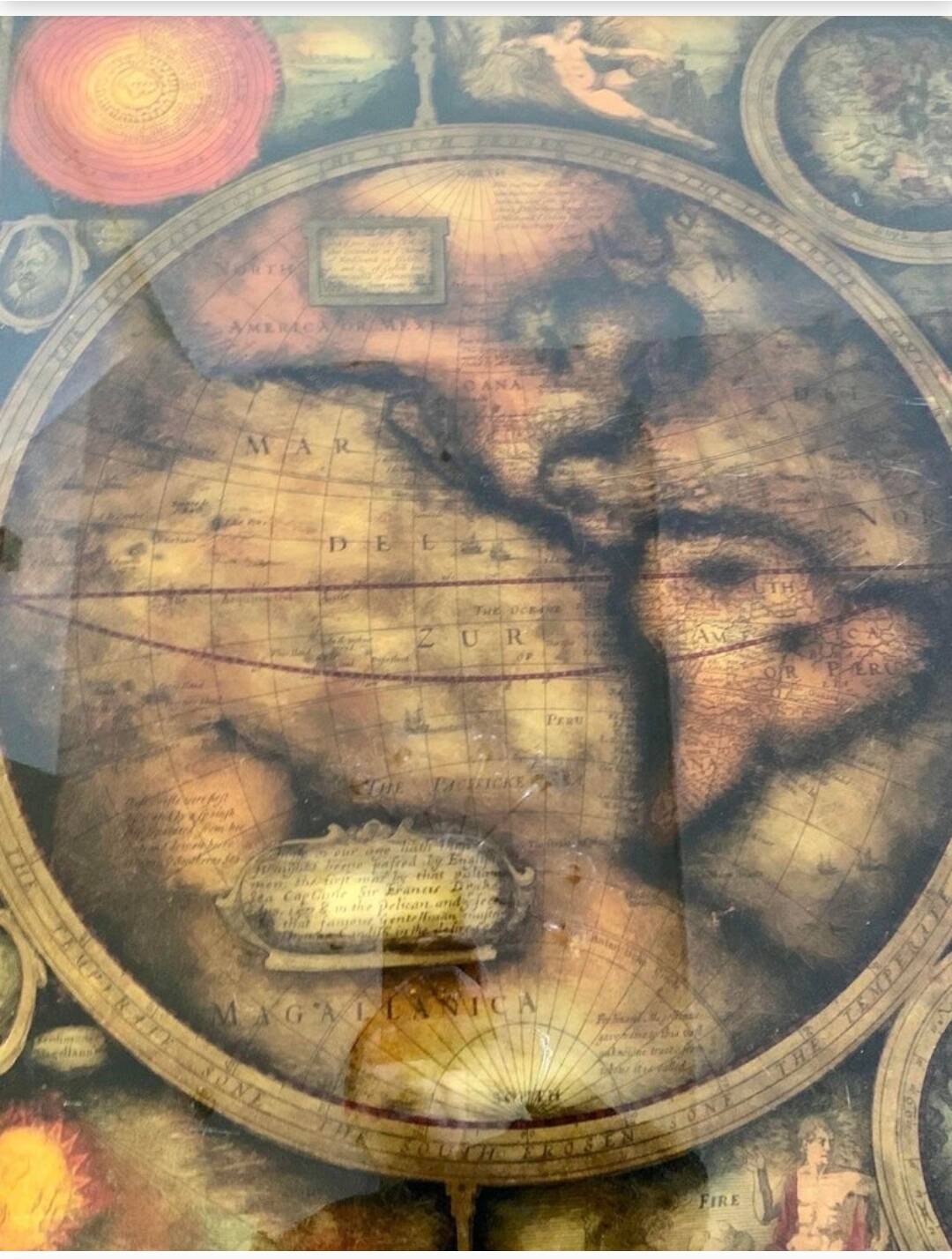 Coffee table in exotic wood, brass trim and planisphere under glass.