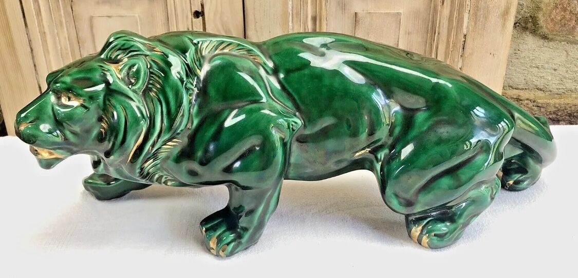 Art Deco lion statue cracked St Clement