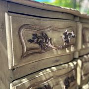 Curved antique commode in pistachio green patina.