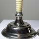 Pair of vintage candlestick holders in silver-plated metal with ivory-style plastic.