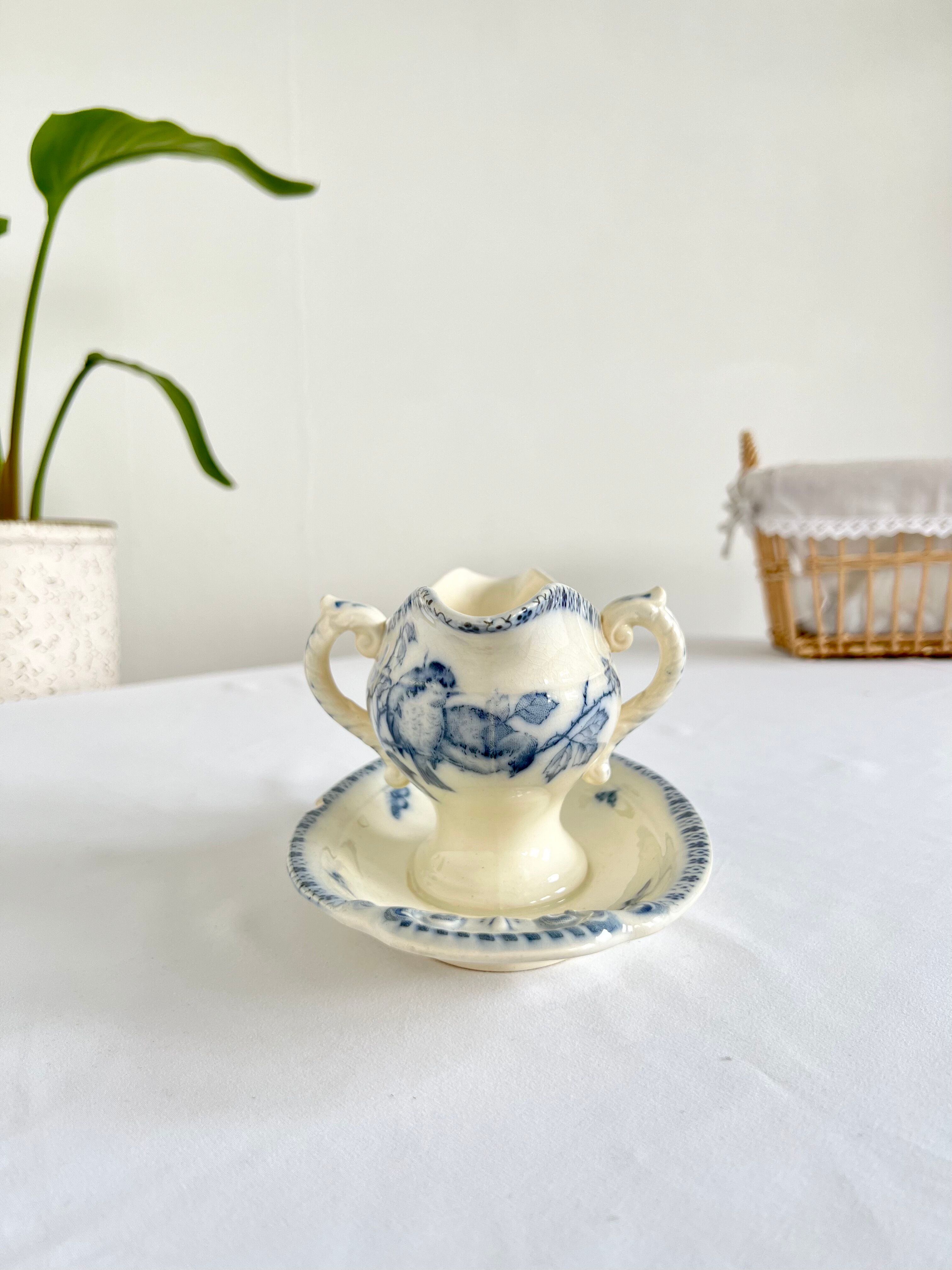 Saucière porcelain stamped Lunéville with double ivory and blue handles