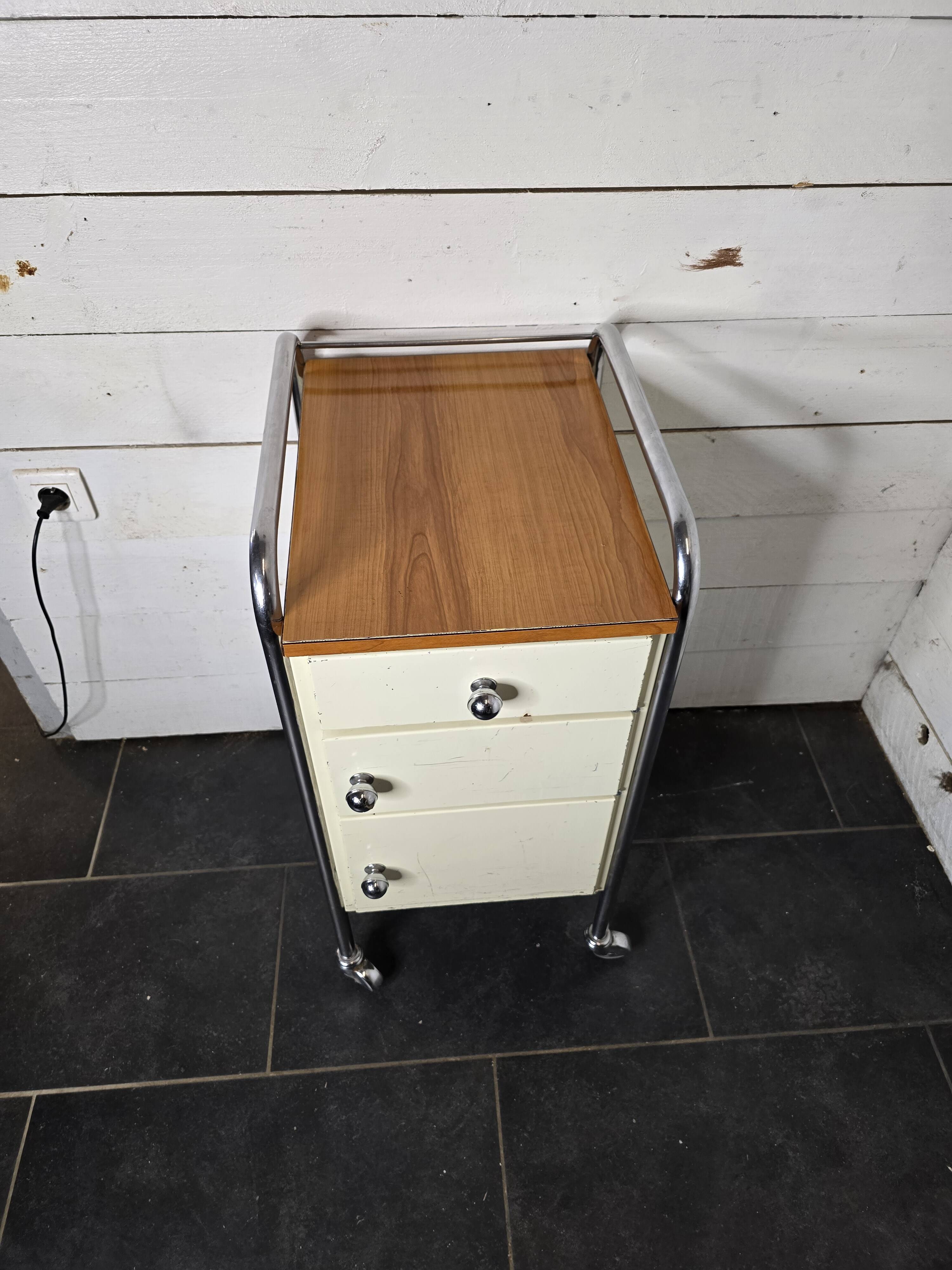 Mid-20th century metal cabinet table on wheels