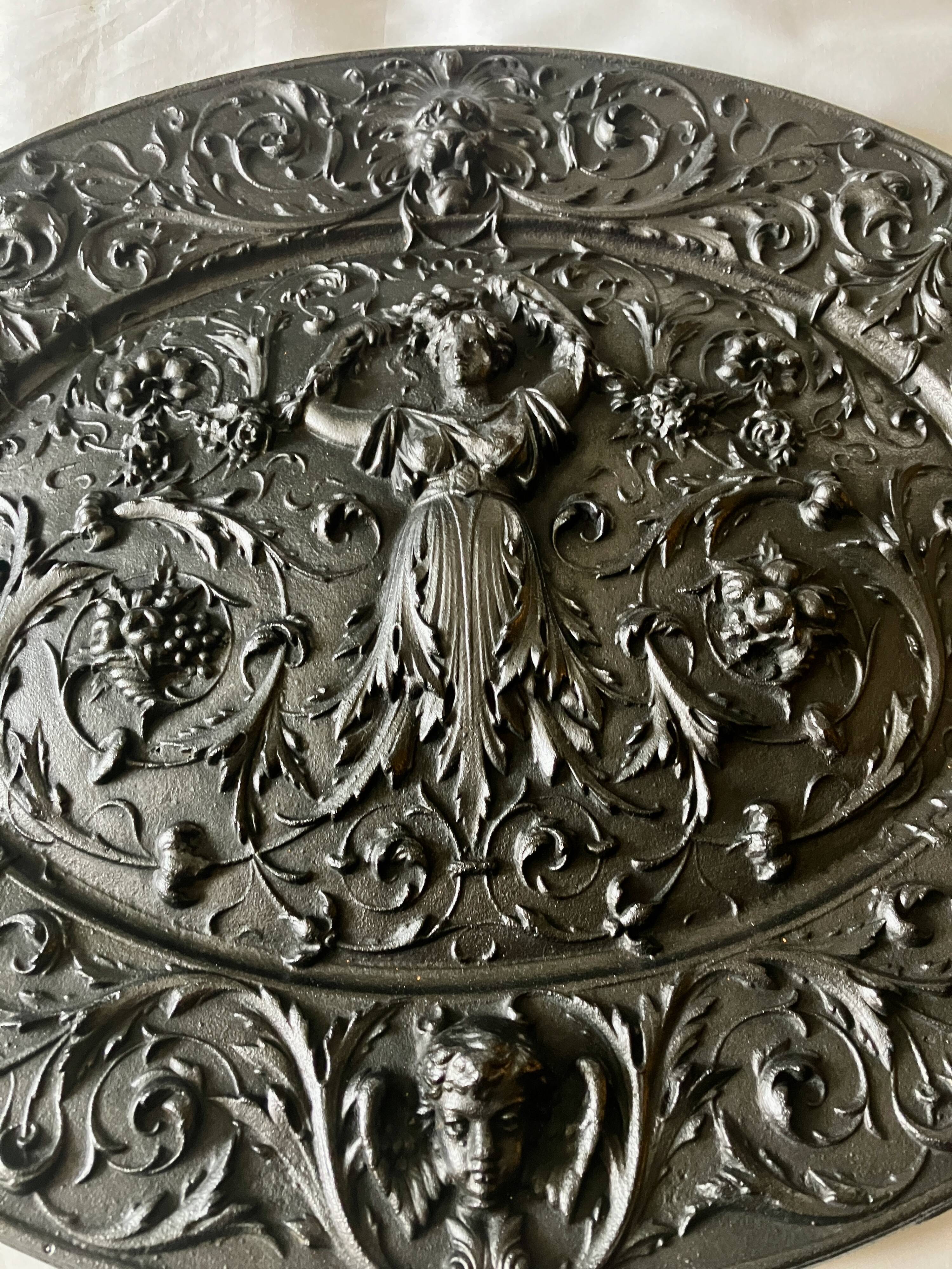 Plaque décorative en fonte début 20°siècle.