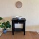 Small Art Deco console reinterpreted – matte black wood with drawer