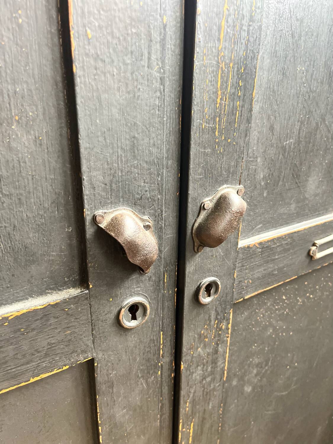 Old wooden locker with black patina