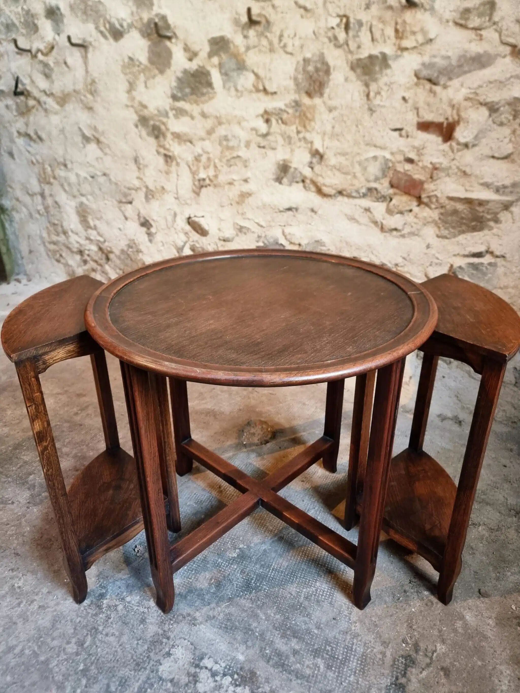 Vintage oak nesting tables set, round coffee table from the 1960s with two integrated side tables.