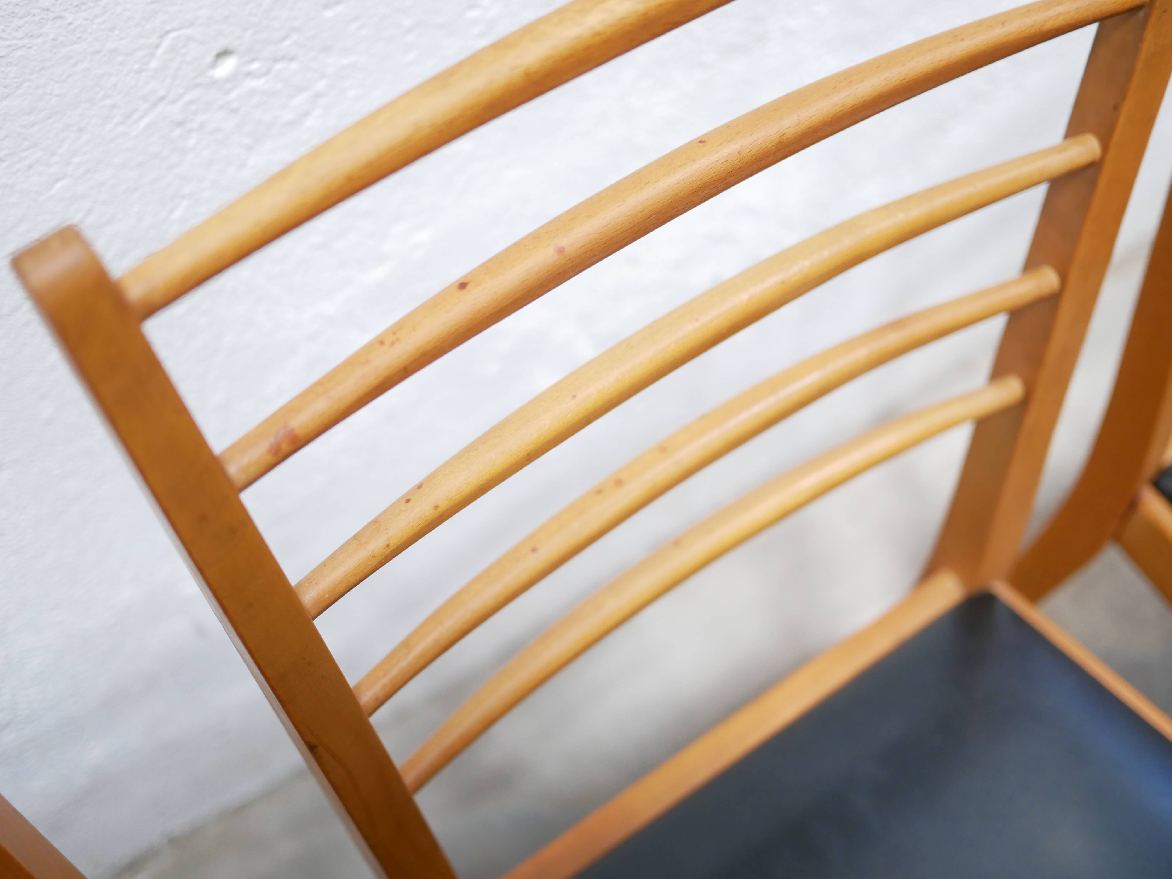 Series of 4 vintage chairs in wood and skaï