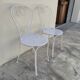 Pair of wrought iron garden chairs, antique manufacture