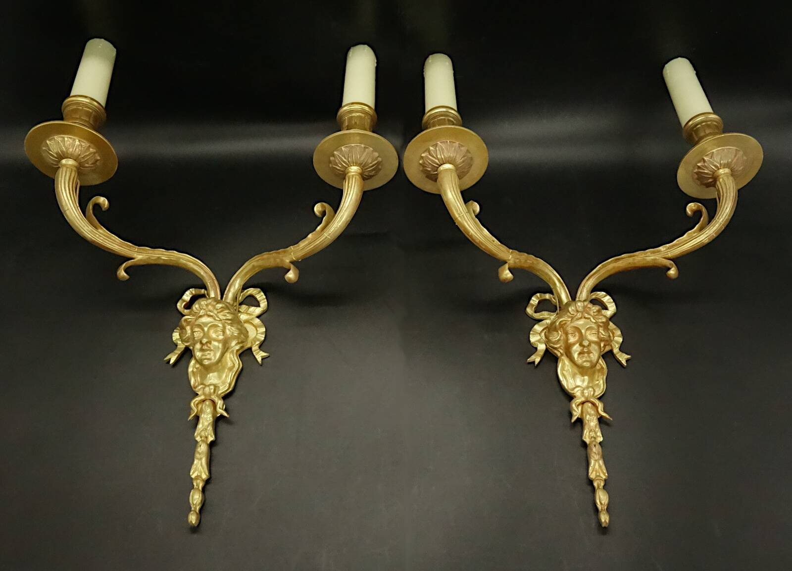 Pair of large Louis XVI style sconces with male faces - bronze