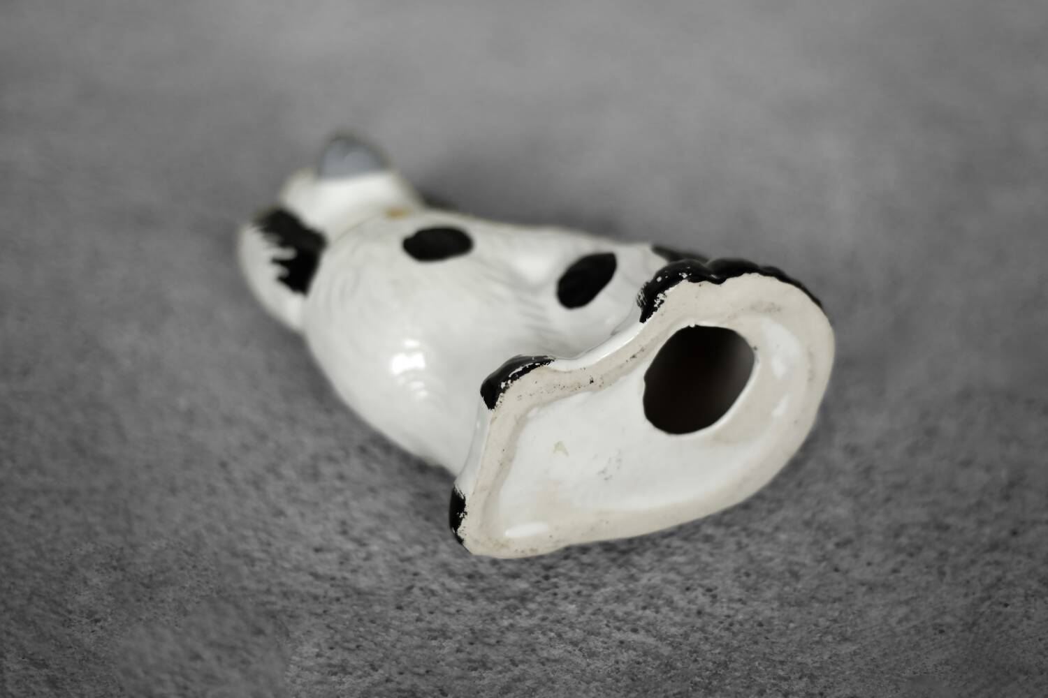 Vintage ceramic figurine from Staffordshire depicting a spaniel dog, England.