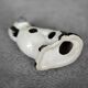 Vintage ceramic figurine from Staffordshire depicting a spaniel dog, England.