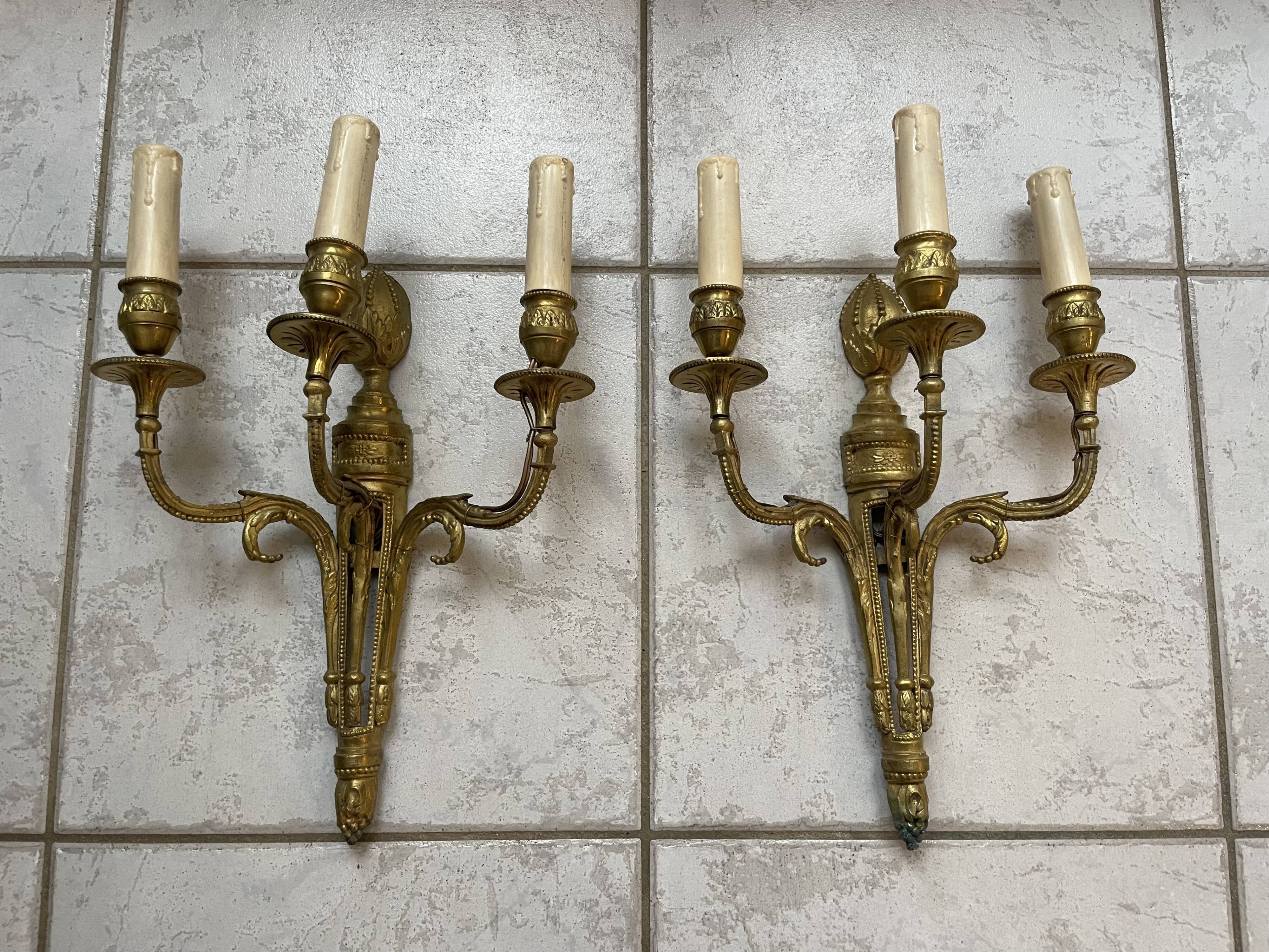 Pairs of Louis XVI bronze wall lamps