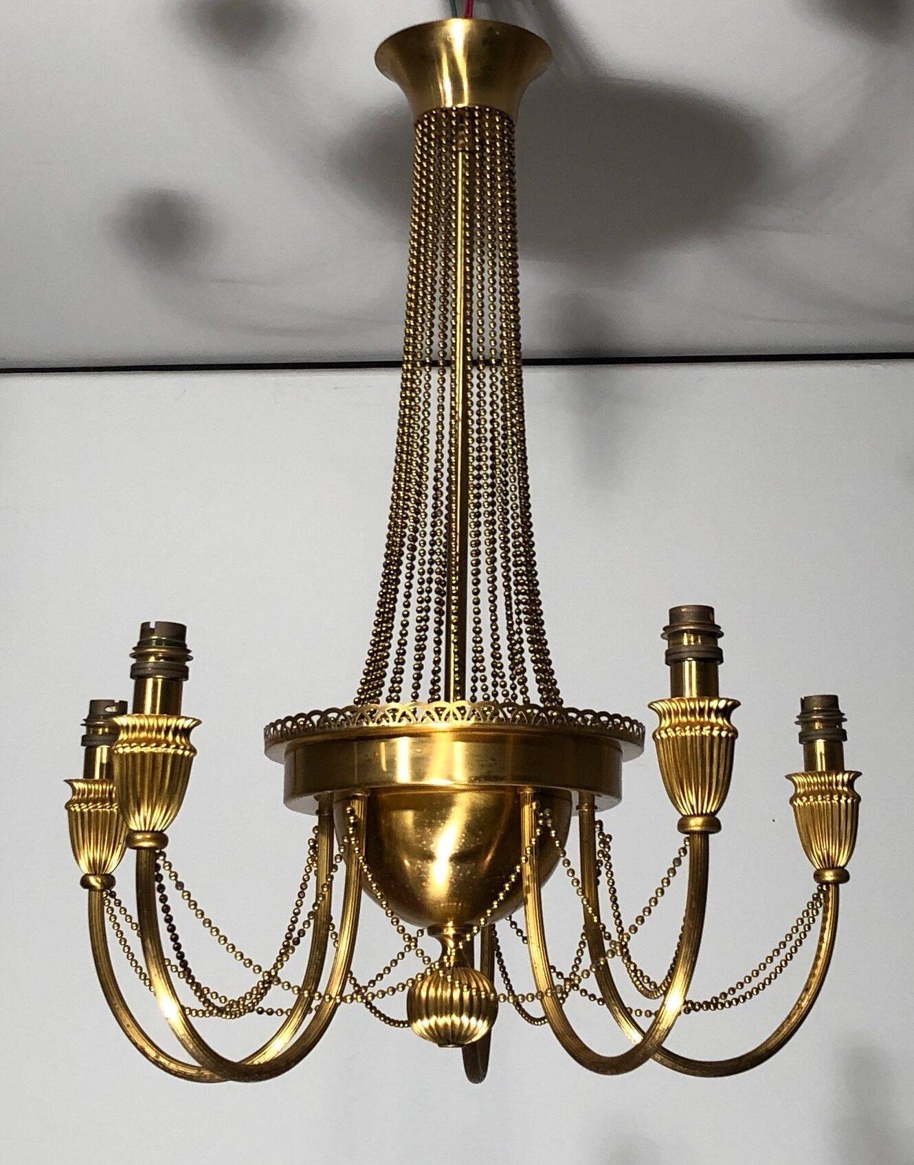 Neoclassical style brass chandelier decorated with pearl garlands