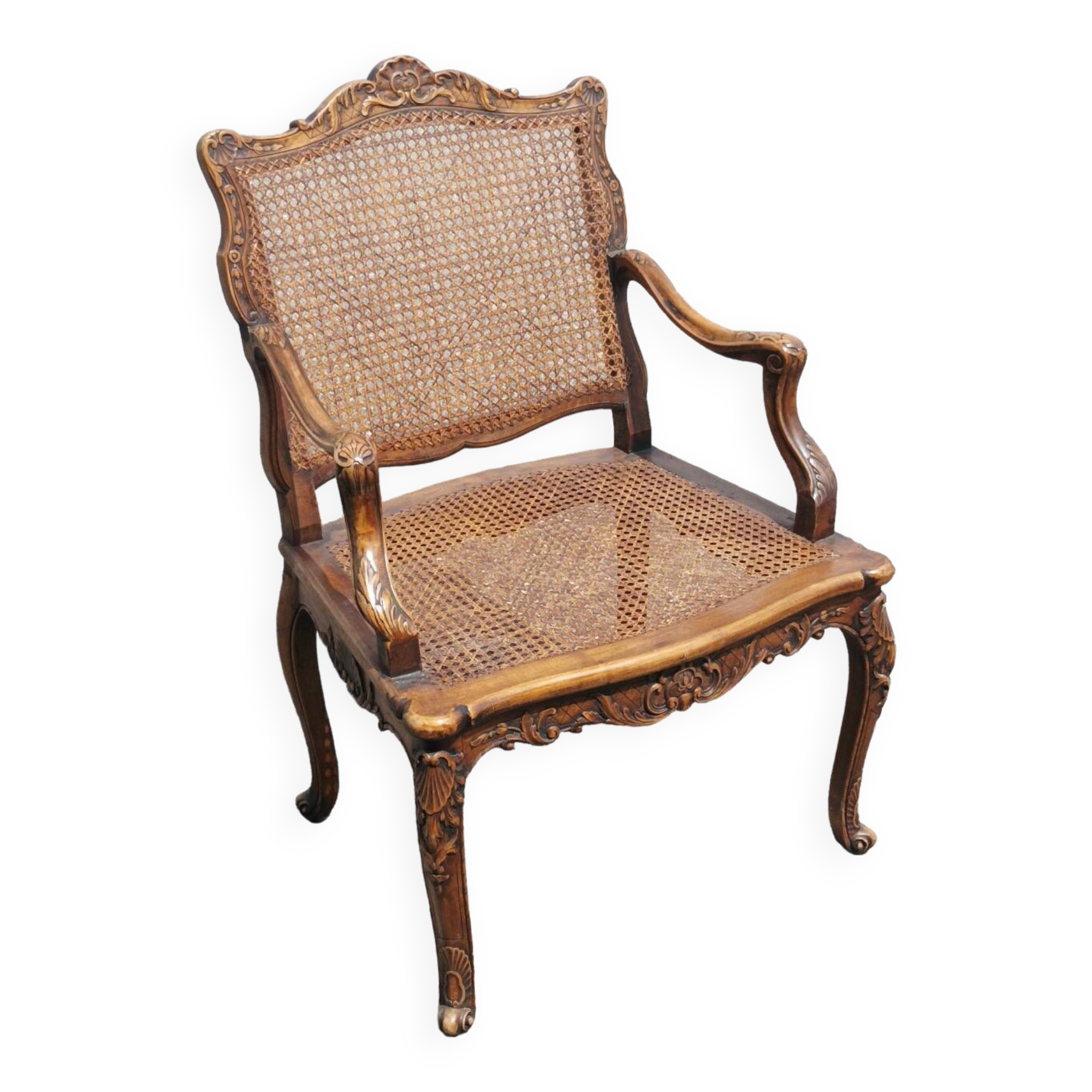 Fauteuil canné sculpté style Régence
