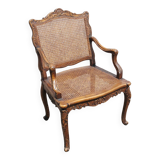 Fauteuil canné sculpté style Régence