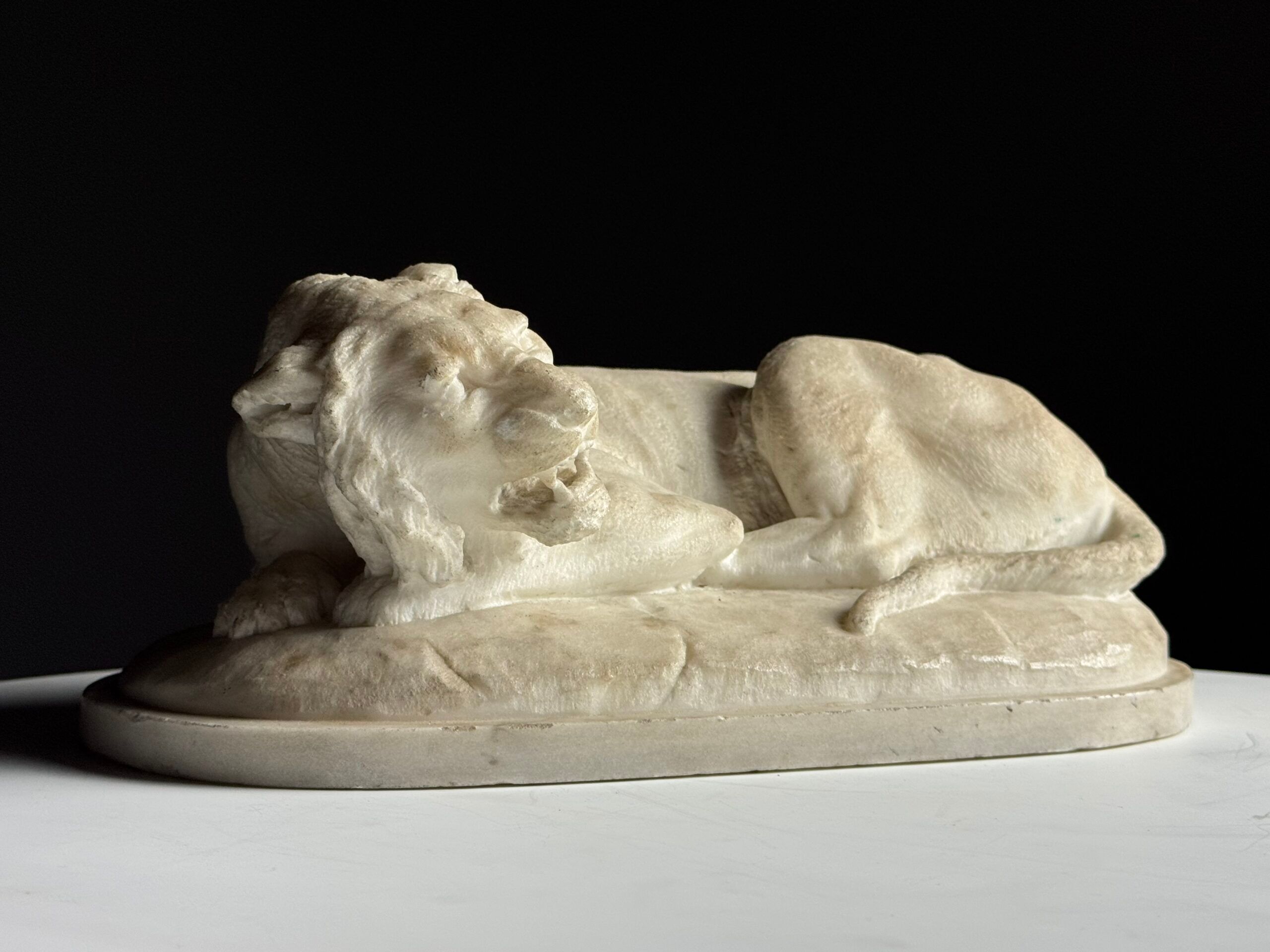 Marble sculpture of a reclining lion