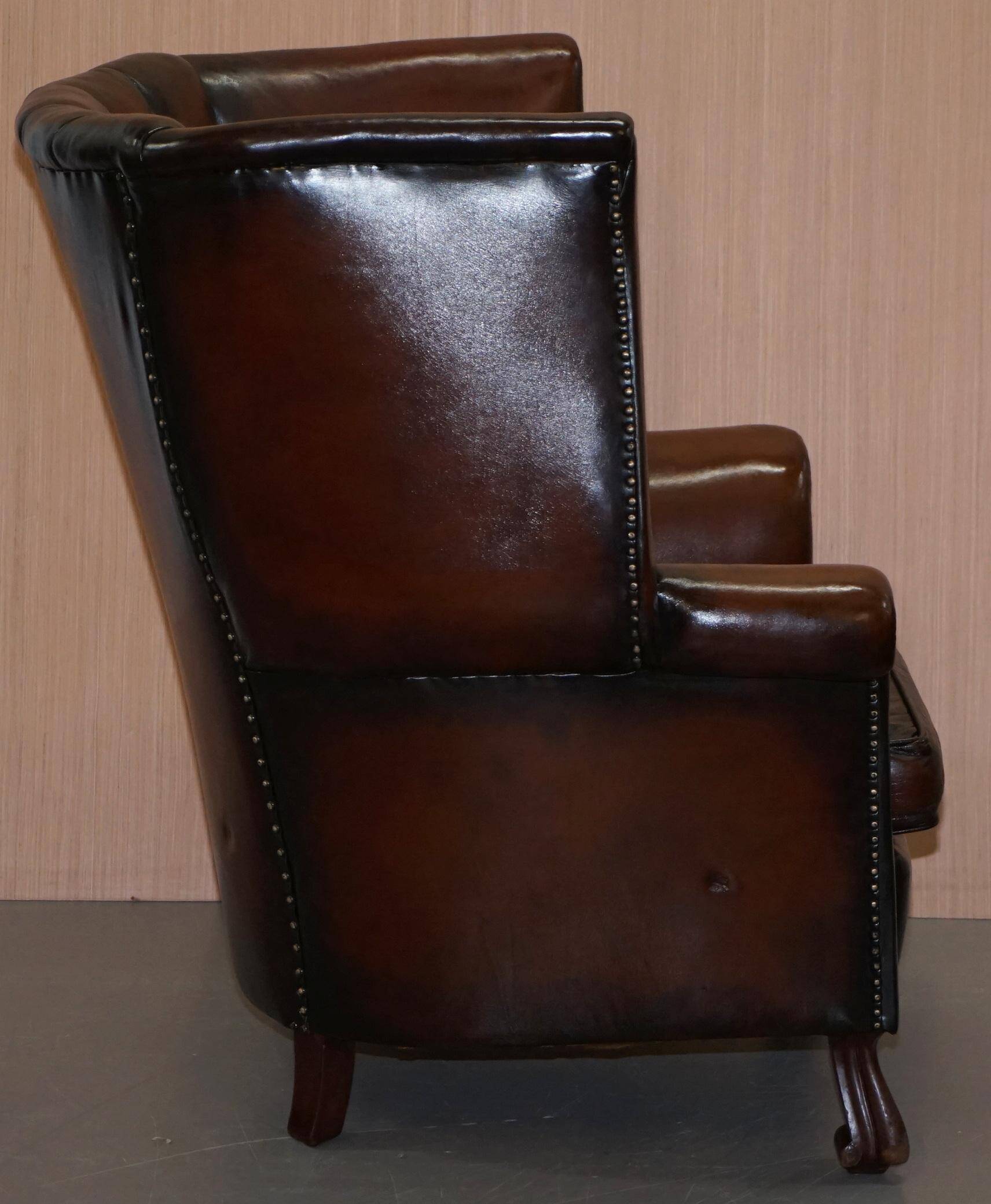 Victorian leather canapé and armchair, barrel back, circa 1860, restored.