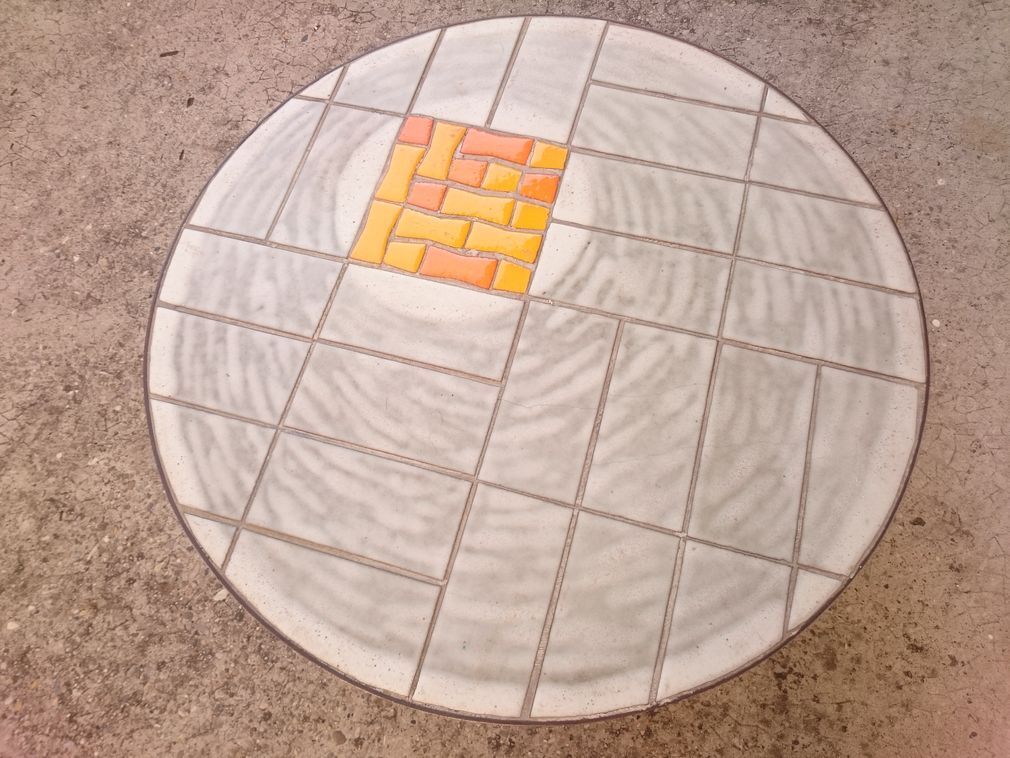 Round ceramic and steel coffee table