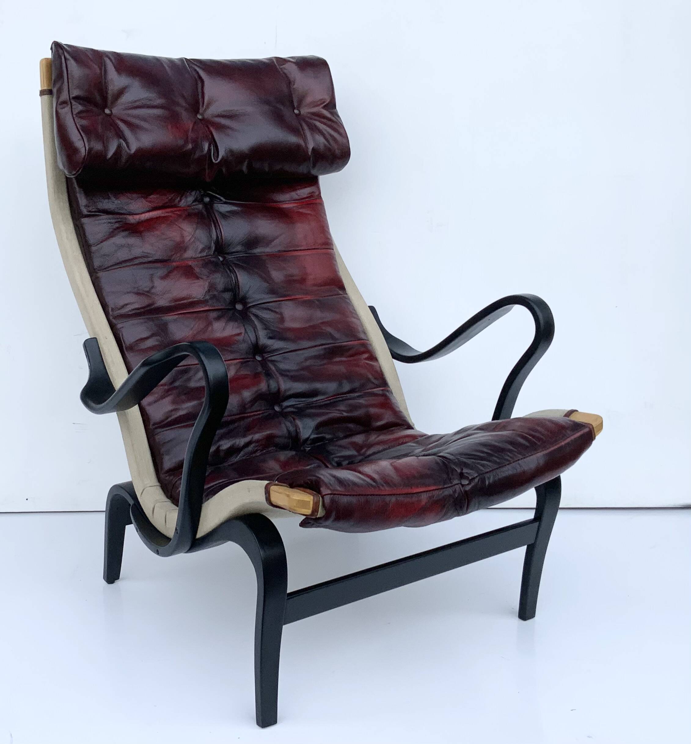 Vintage Pernilla 69 Armchair by Bruno Mathsson for Dux In Oxblood Leather