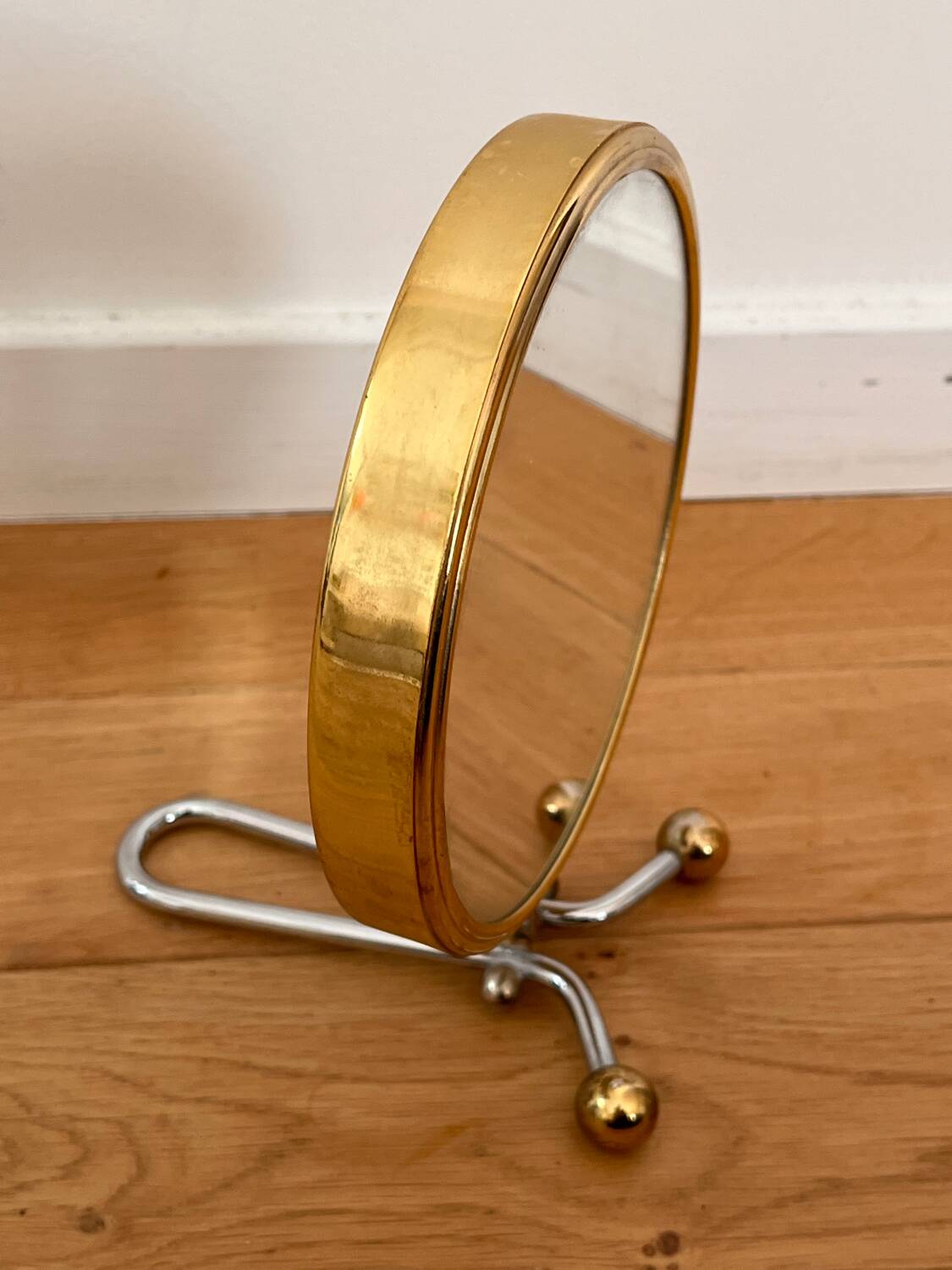 Magnifying brass mirror