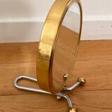 Magnifying brass mirror