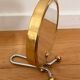Magnifying brass mirror