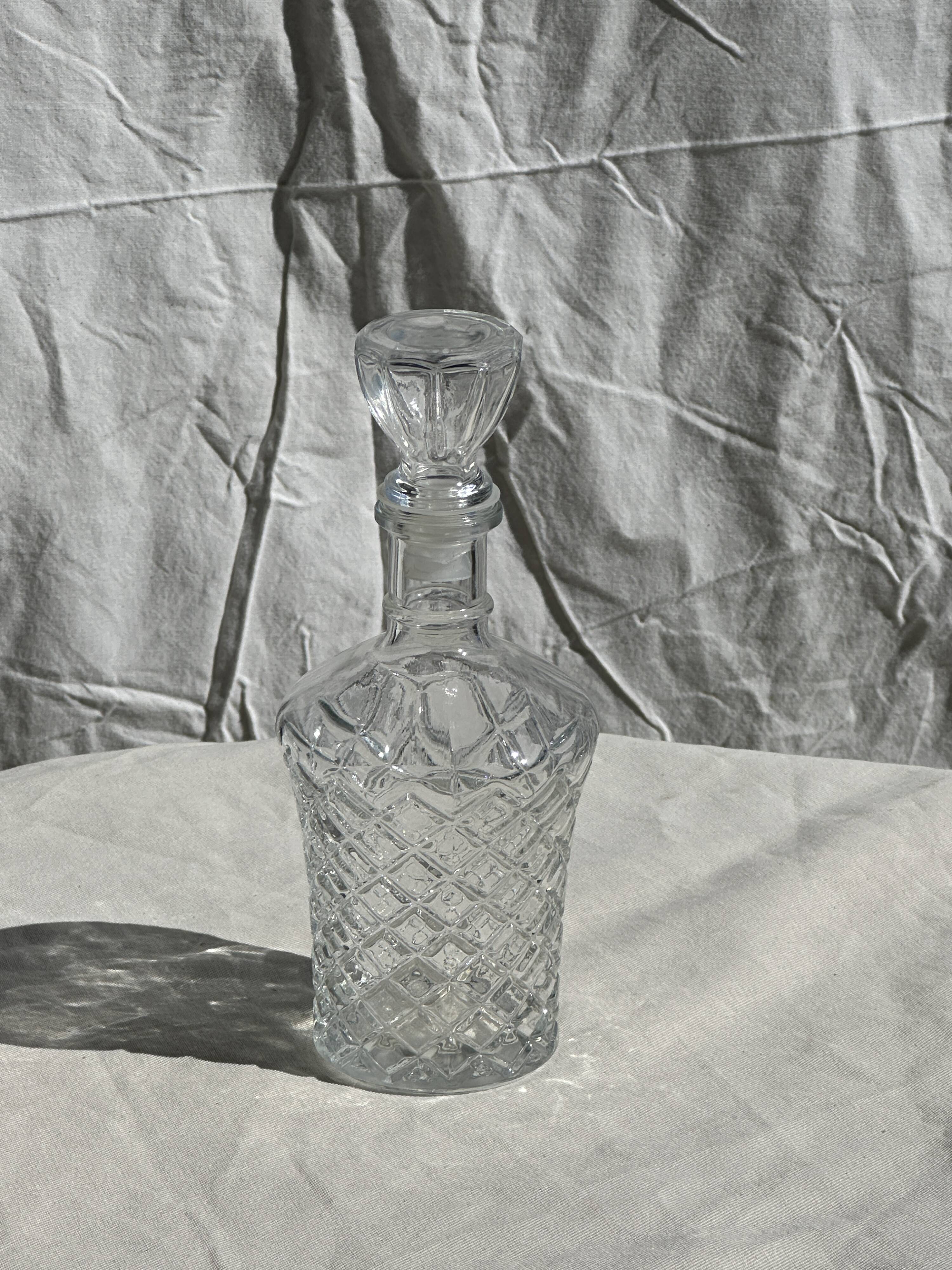 Small cylindrical glass whiskey decanter H:23
