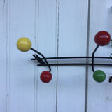Roger Feraud wall-mounted wooden coat rack with colored balls, 1950