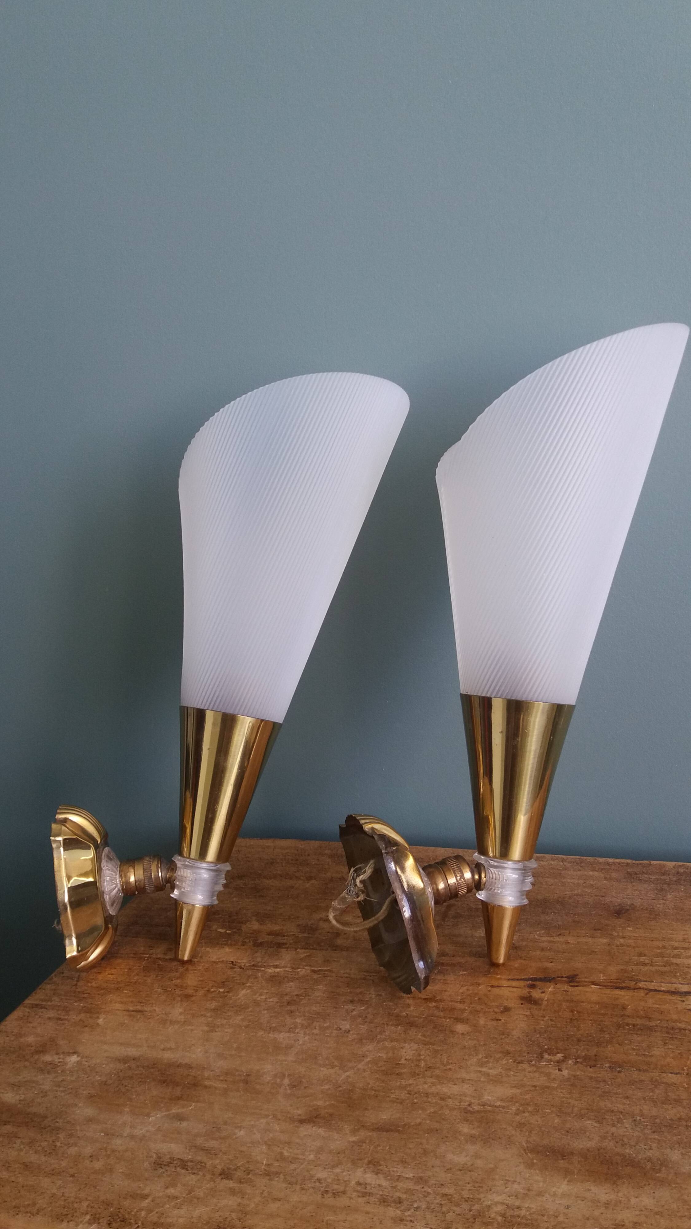 Brass and plexiglass wall lights in the Maison Lunel style.