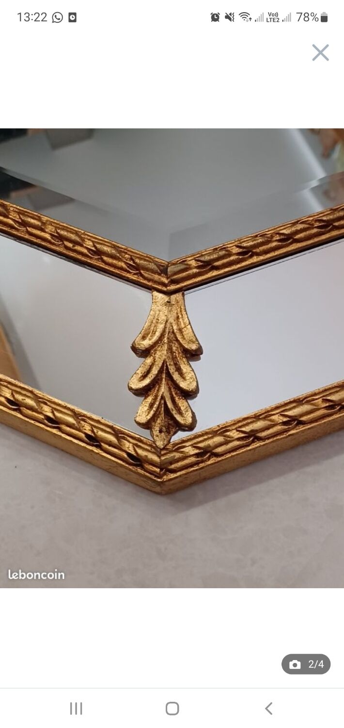 Octagonal mirror with golden wood frame