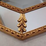 Octagonal mirror with golden wood frame