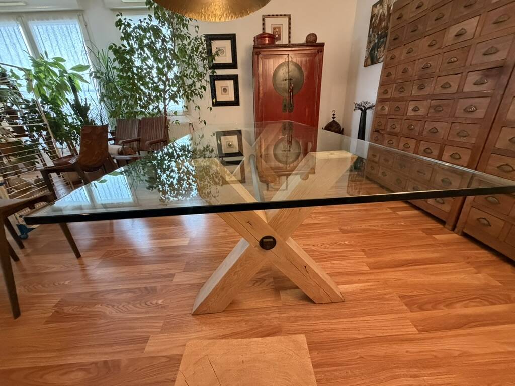 Rectangular dining table with glass top from Roche Bobois.