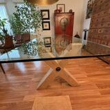 Rectangular dining table with glass top from Roche Bobois.