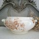 Antique iron earthenware plates accompanied by dishes