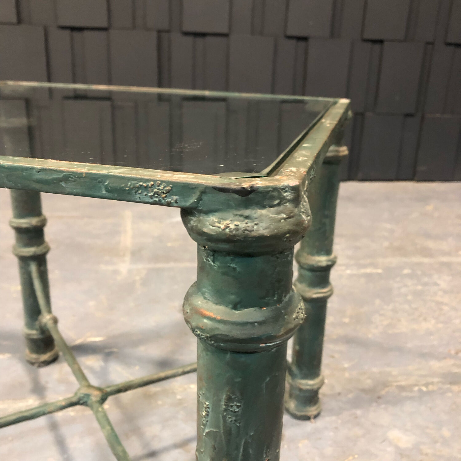 Iron and glass side table with antique patina