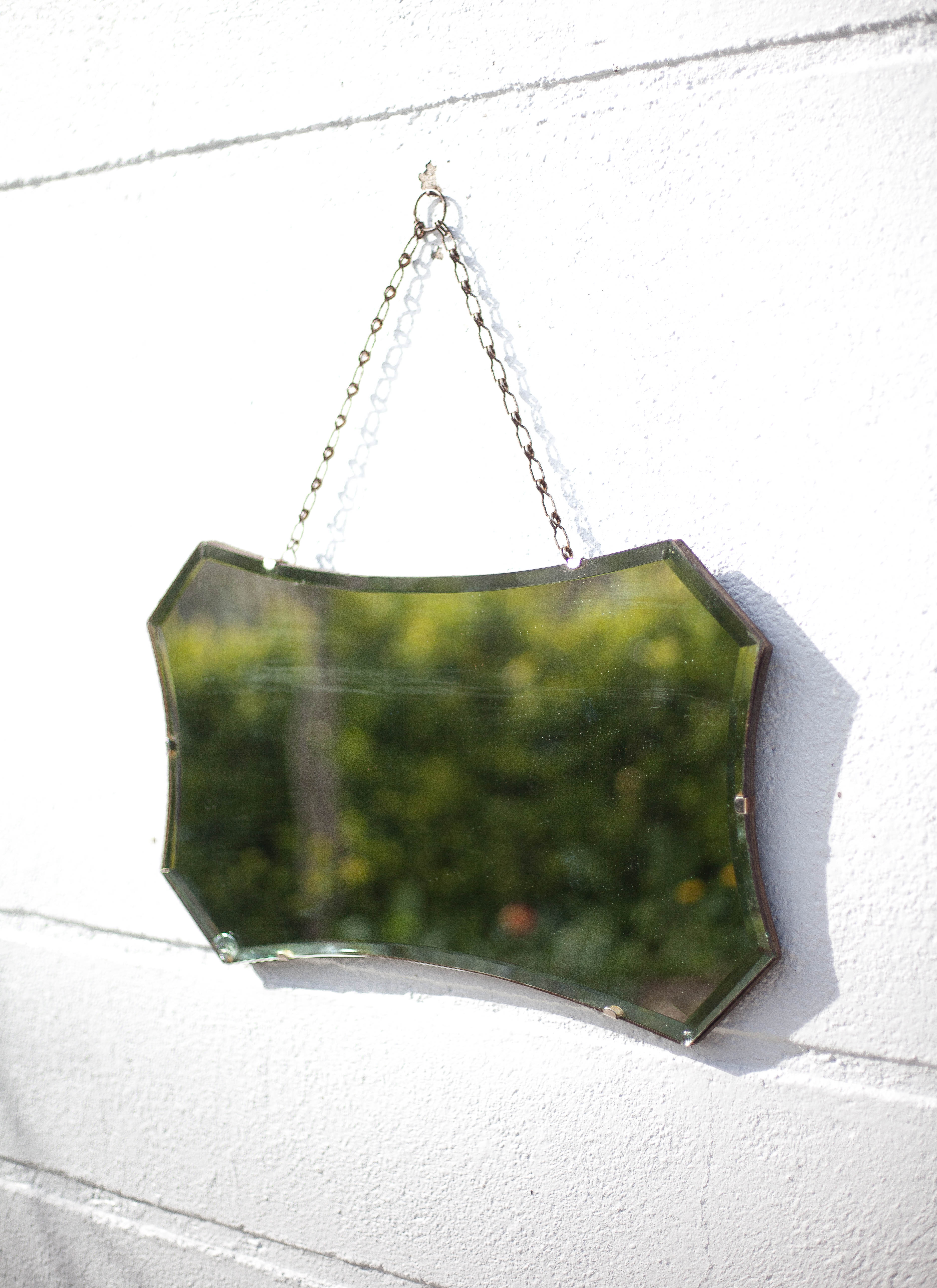 Vintage wall mirror with beveled chain
